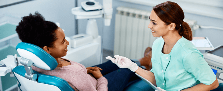 dentist speaking with a dental patient