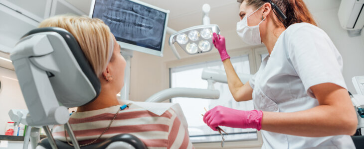 Dentist doctor examination Dental X-rays scan. Dental clinic patient visit modern medical ward. Female sitting in comfortable chair. Health care, medicare industry, healthcare technology concept image